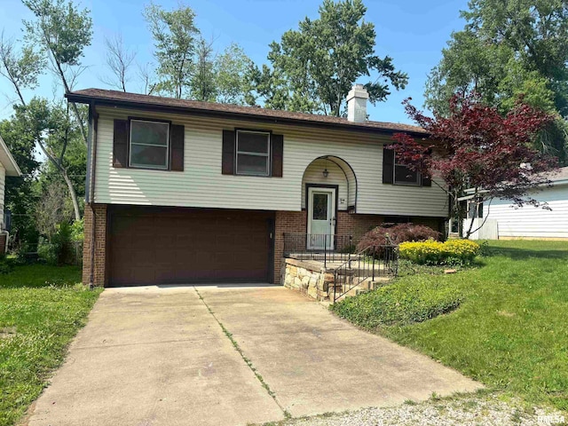31 Glenwood Ln, Chatham, IL 62629 - split foyer home with an attached garage, driveway, a front yard, a chimney, and brick siding