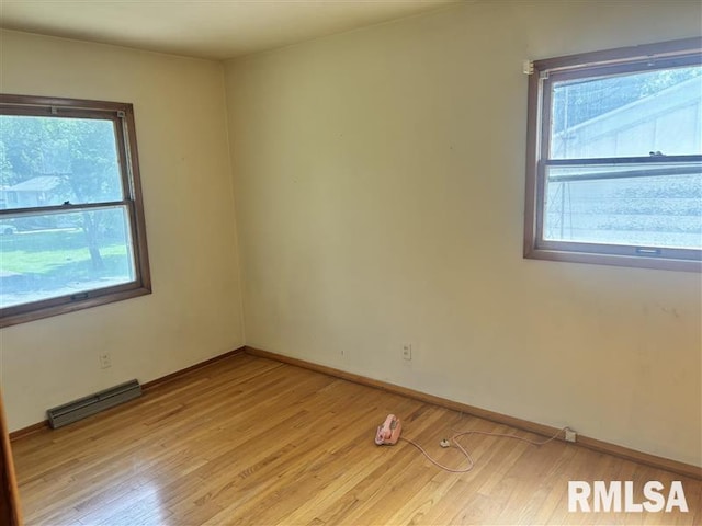 31 Glenwood Ln, Chatham, IL 62629 - spare room featuring light wood-type flooring and baseboards