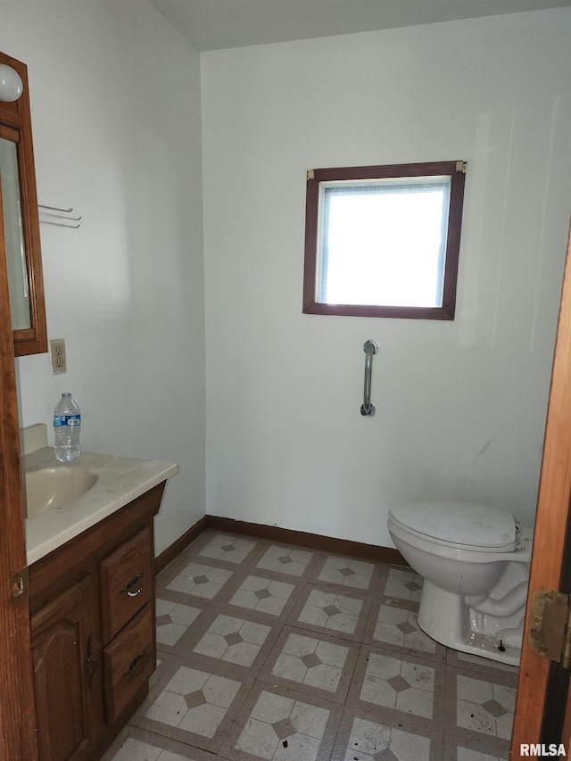 333 S Elm St, Lincoln, IL 62656 - bathroom featuring vanity and toilet