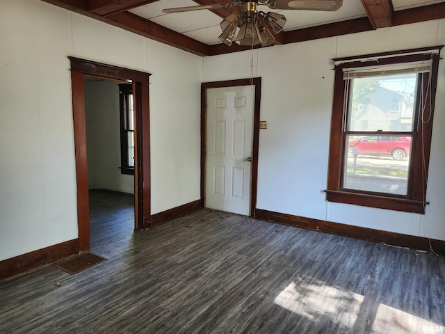 333 S Elm St, Lincoln, IL 62656 - spare room with ceiling fan, beamed ceiling, and dark wood finished floors