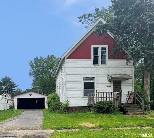 872 E 4th St, Galesburg, IL 61401 - view of front of home featuring an outbuilding, a detached garage, a front yard, and a wooden deck