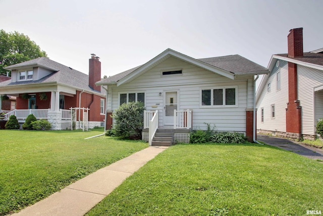 2204 Spring St, Quincy, IL 62301 - view of front of house with a front yard and a porch