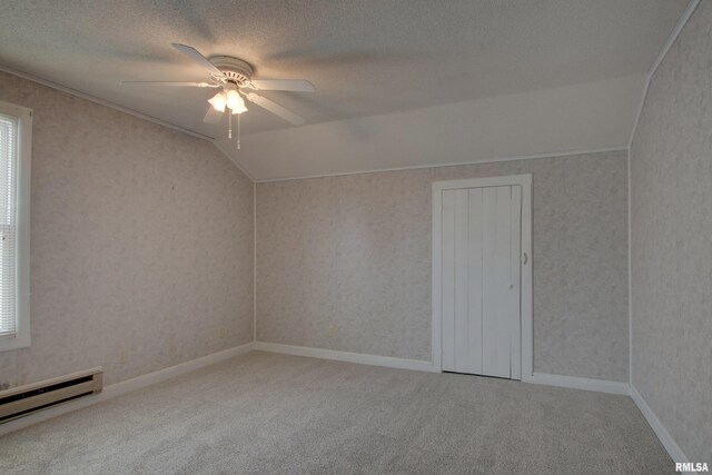 2204 Spring St, Quincy, IL 62301 - additional living space with a baseboard radiator, ceiling fan, carpet flooring, wallpapered walls, and lofted ceiling
