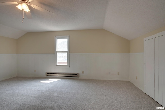 2204 Spring St, Quincy, IL 62301 - bonus room with a baseboard heating unit, lofted ceiling, a wainscoted wall, ceiling fan, and carpet