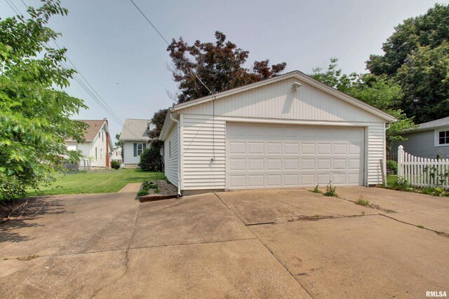 2204 Spring St, Quincy, IL 62301 - view of front facade with a garage and an outbuilding