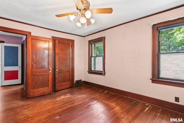 1537 N 4th St, Springfield, IL 62702 - unfurnished bedroom featuring hardwood / wood-style floors, multiple windows, crown molding, and a ceiling fan