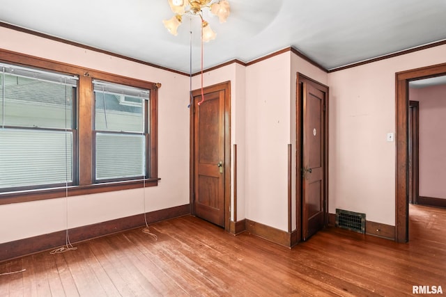 1537 N 4th St, Springfield, IL 62702 - spare room featuring hardwood / wood-style flooring and crown molding