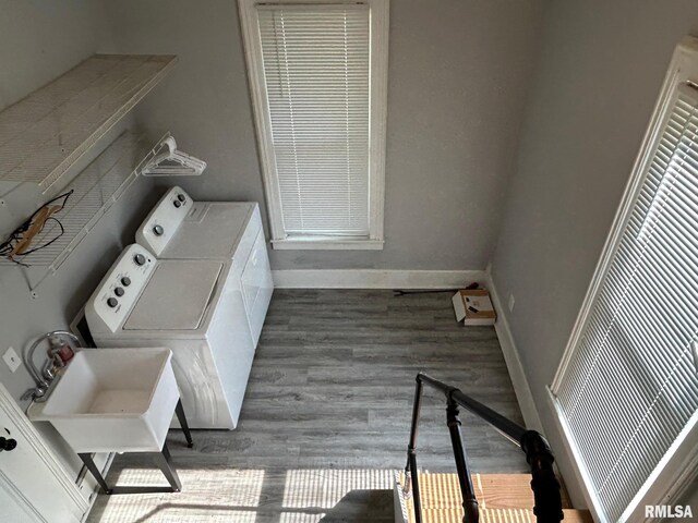 726 W N St, Auburn, IL 62629 - washroom with washer and clothes dryer, wood finished floors, and a heating unit