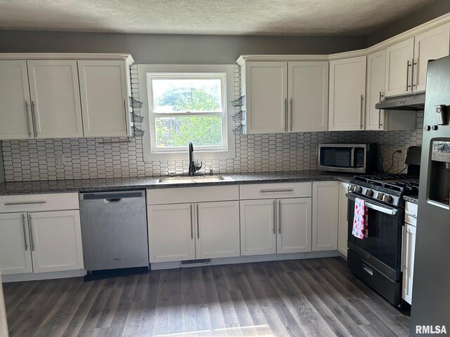726 W N St, Auburn, IL 62629 - unfurnished dining area with dark wood-style floors and baseboards
