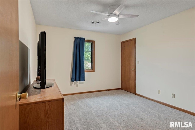 5309 Collins Way, Springfield, IL 62703 - unfurnished bedroom featuring light carpet, a textured ceiling, and ceiling fan