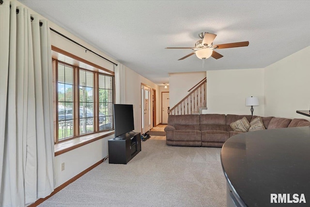 5309 Collins Way, Springfield, IL 62703 - living room with a ceiling fan, stairway, and light colored carpet