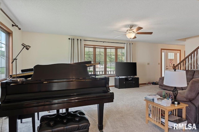 5309 Collins Way, Springfield, IL 62703 - carpeted living area featuring healthy amount of natural light, ceiling fan, a textured ceiling, and stairs