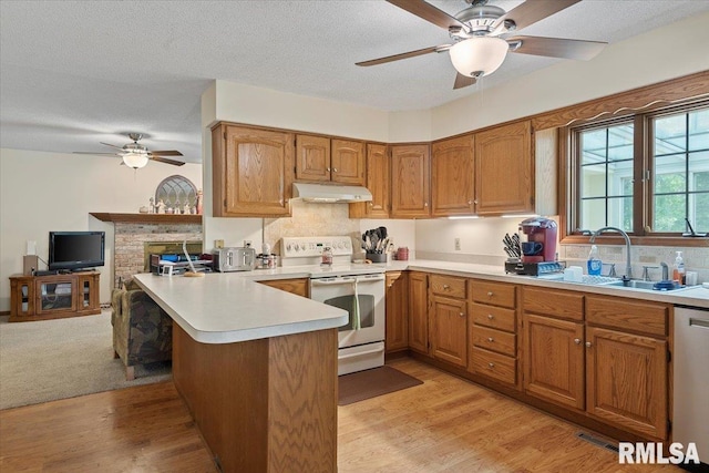5309 Collins Way, Springfield, IL 62703 - kitchen with white range with electric cooktop, under cabinet range hood, ceiling fan, a peninsula, and dishwasher