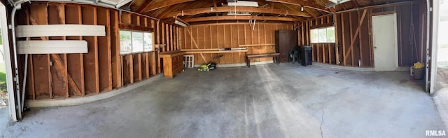 805 W Washington St, Pittsfield, IL 62363 - misc room with a garage, concrete floors, and vaulted ceiling