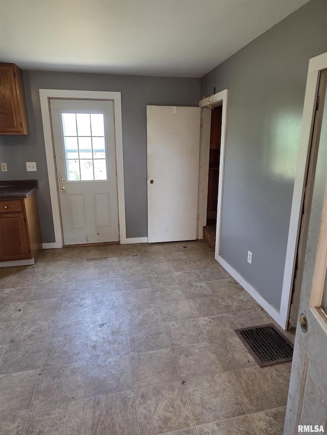 1355 Old Wagon Rd, Knoxville, IL 61448 - unfurnished dining area featuring baseboards