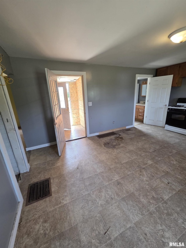 1355 Old Wagon Rd, Knoxville, IL 61448 - unfurnished living room with baseboards and stone finish floors