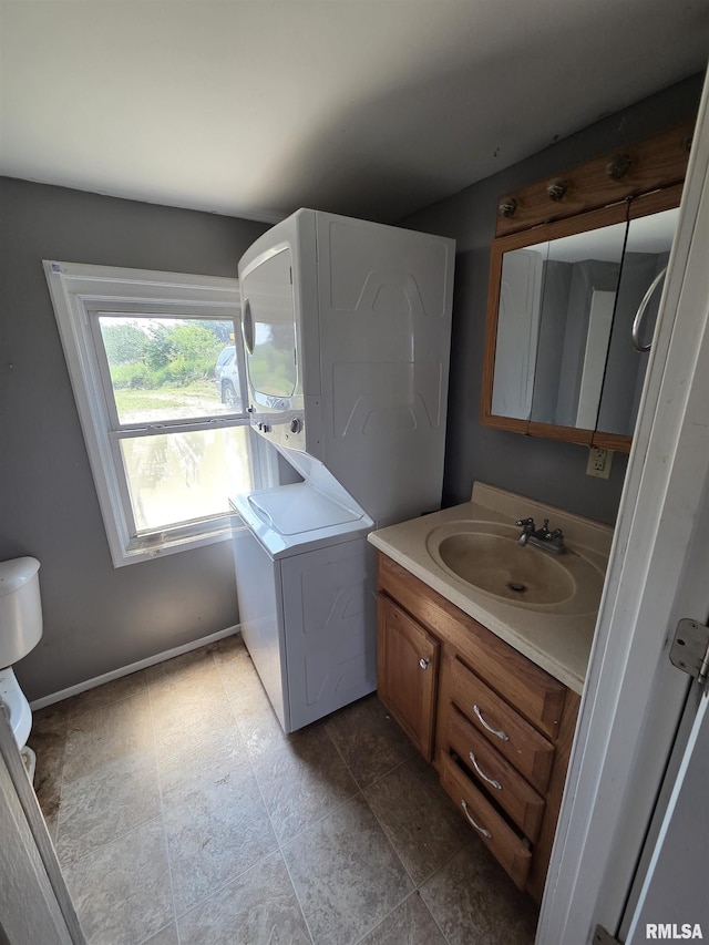 1355 Old Wagon Rd, Knoxville, IL 61448 - bathroom with stacked washer / dryer and vanity