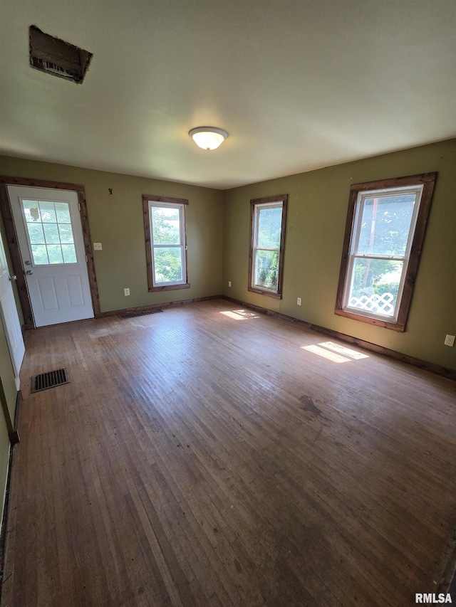 1355 Old Wagon Rd, Knoxville, IL 61448 - unfurnished living room featuring wood finished floors and baseboards