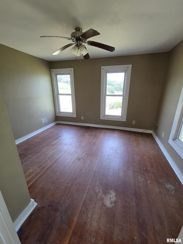 1355 Old Wagon Rd, Knoxville, IL 61448 - unfurnished room with plenty of natural light, dark wood-style floors, and a ceiling fan