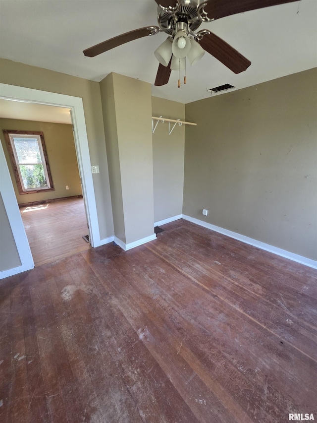 1355 Old Wagon Rd, Knoxville, IL 61448 - unfurnished bedroom with wood-type flooring and ceiling fan