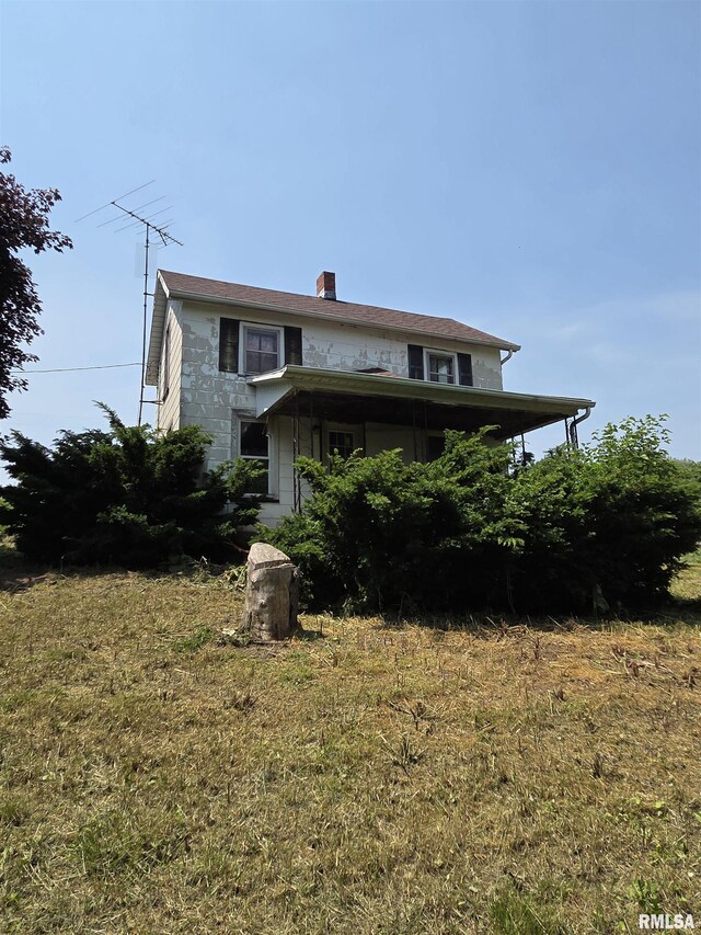 1355 Old Wagon Rd, Knoxville, IL 61448 - rear view of property featuring a chimney and a lawn
