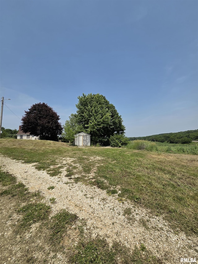 1355 Old Wagon Rd, Knoxville, IL 61448 - view of yard with a storage shed and a view of countryside