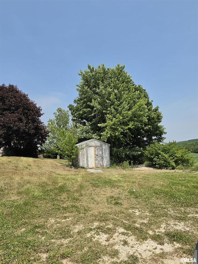 1355 Old Wagon Rd, Knoxville, IL 61448 - view of green lawn featuring a storage shed