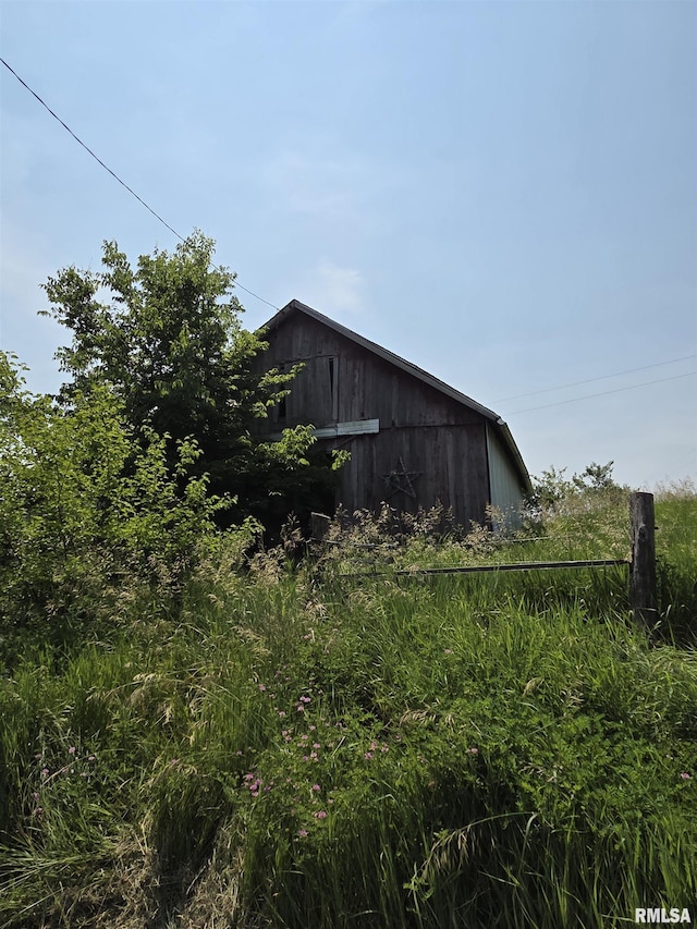 1355 Old Wagon Rd, Knoxville, IL 61448 - view of home's exterior with an outdoor structure and a barn