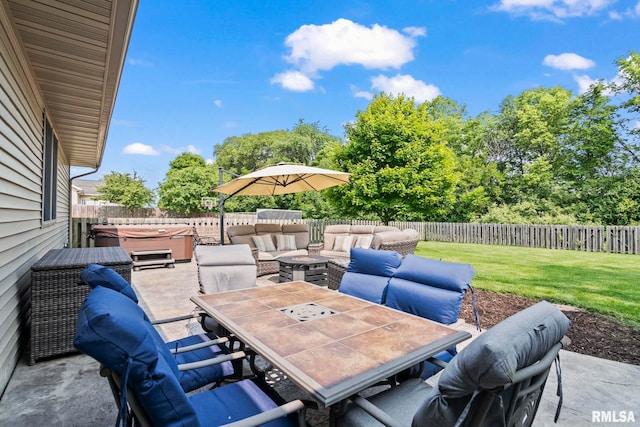 5313 Jaeger Dr, Springfield, IL 62711 - fenced backyard with a hot tub, a patio, outdoor dining area, and an outdoor hangout area