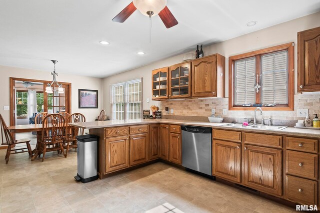 5313 Jaeger Dr, Springfield, IL 62711 - kitchen with stainless steel dishwasher, brown cabinets, a peninsula, plenty of natural light, and recessed lighting