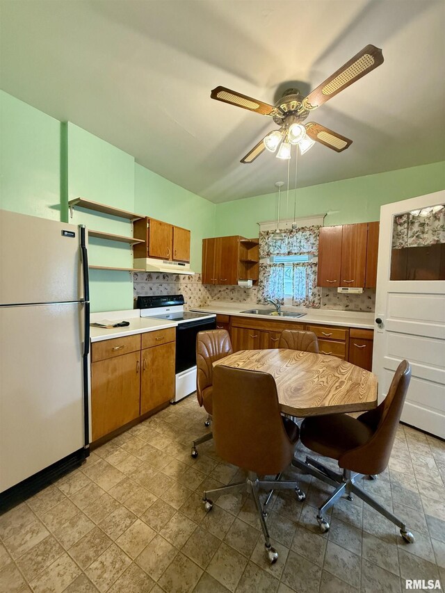 305 N Harshbarger St, Abingdon, IL 61410 - kitchen featuring freestanding refrigerator, open shelves, electric range oven, and brown cabinets