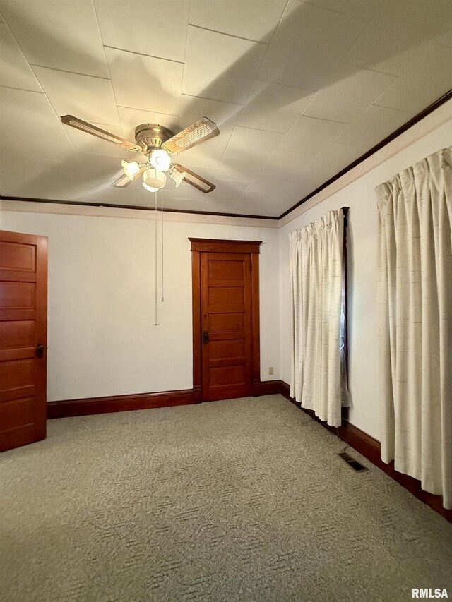 305 N Harshbarger St, Abingdon, IL 61410 - carpeted spare room featuring ceiling fan and baseboards