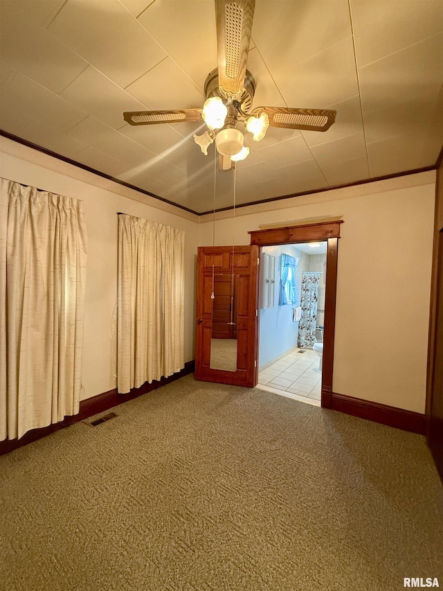 305 N Harshbarger St, Abingdon, IL 61410 - unfurnished room featuring ceiling fan and light colored carpet