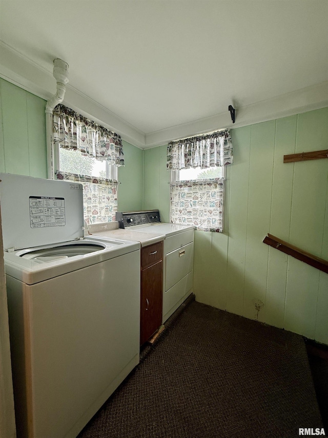 305 N Harshbarger St, Abingdon, IL 61410 - laundry room featuring washing machine and clothes dryer, dark colored carpet, cabinet space, a decorative wall, and ornamental molding