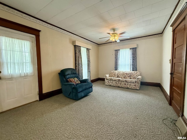 305 N Harshbarger St, Abingdon, IL 61410 - living area featuring light carpet, crown molding, and ceiling fan