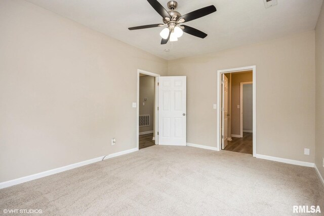 713 S Jackson St, Litchfield, IL 62056 - unfurnished bedroom featuring carpet floors and a ceiling fan