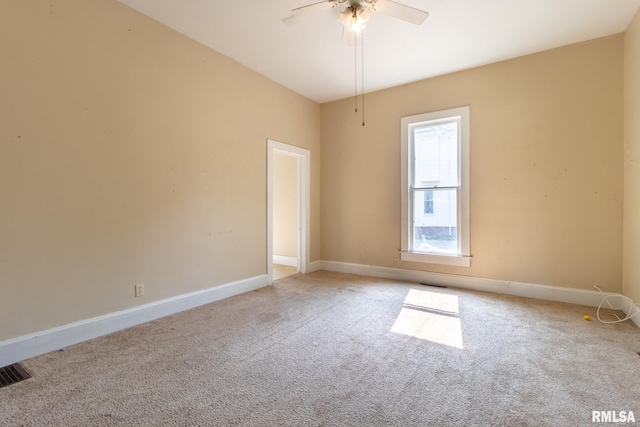 117 W Jefferson St, Macomb, IL 61455 - unfurnished room with light colored carpet and ceiling fan