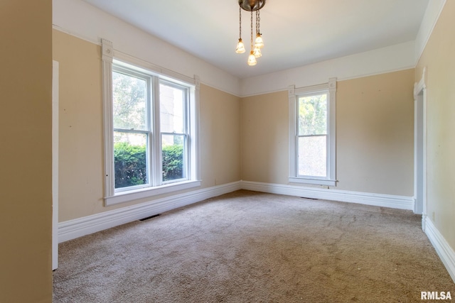 117 W Jefferson St, Macomb, IL 61455 - carpeted spare room featuring baseboards