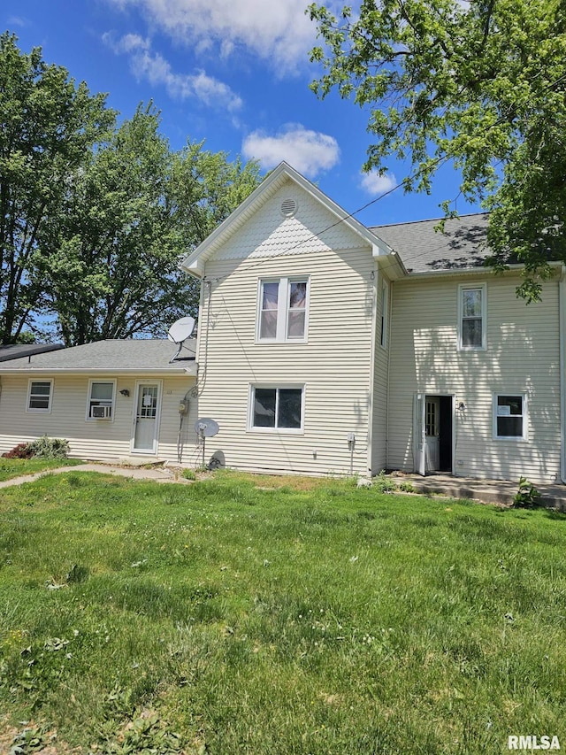 113 S Franklin St, Camp Point, IL 62320 - back of property featuring a lawn