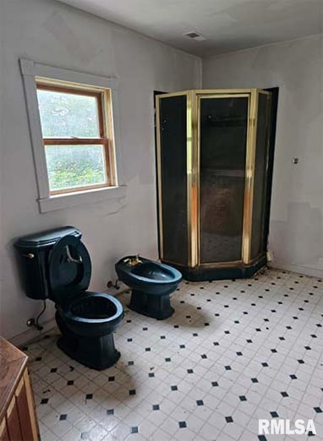 113 S Franklin St, Camp Point, IL 62320 - bathroom featuring vanity, a shower stall, and tile patterned floors