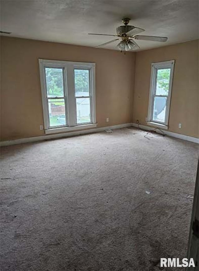 113 S Franklin St, Camp Point, IL 62320 - empty room with ceiling fan and carpet