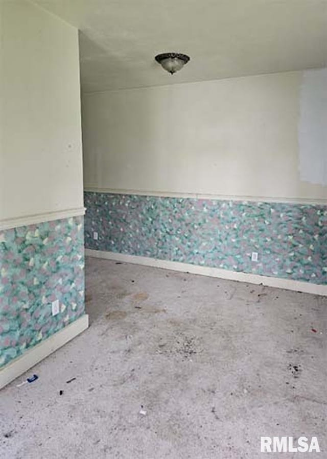 113 S Franklin St, Camp Point, IL 62320 - spare room with unfinished concrete flooring and wallpapered walls