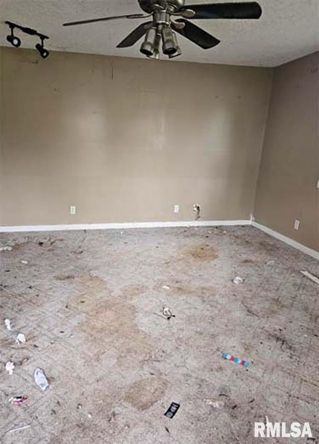 113 S Franklin St, Camp Point, IL 62320 - unfurnished room featuring a ceiling fan and a textured ceiling