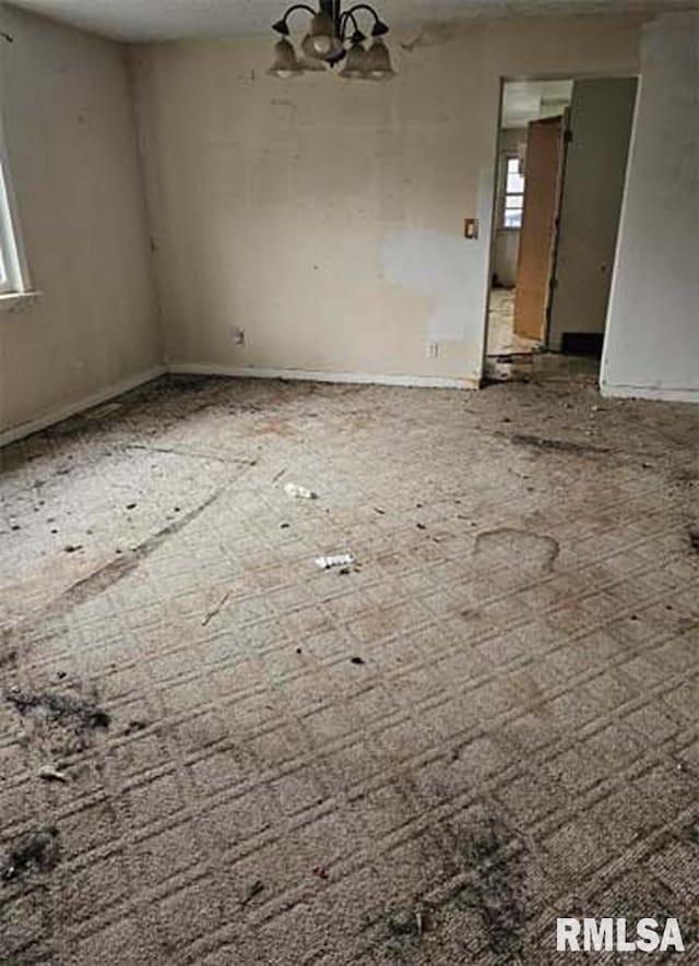 113 S Franklin St, Camp Point, IL 62320 - unfurnished room with a chandelier
