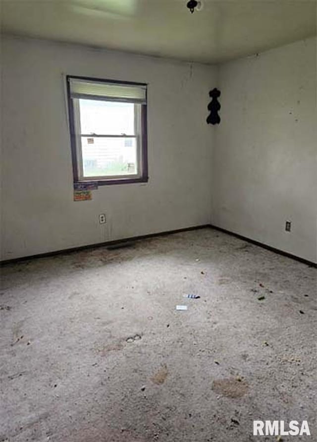 113 S Franklin St, Camp Point, IL 62320 - empty room featuring baseboards