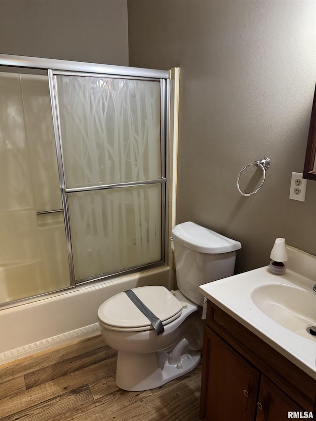 10333 Evergreen Dr, Manito, IL 61546 - bathroom with vanity, bath / shower combo with glass door, and wood finished floors