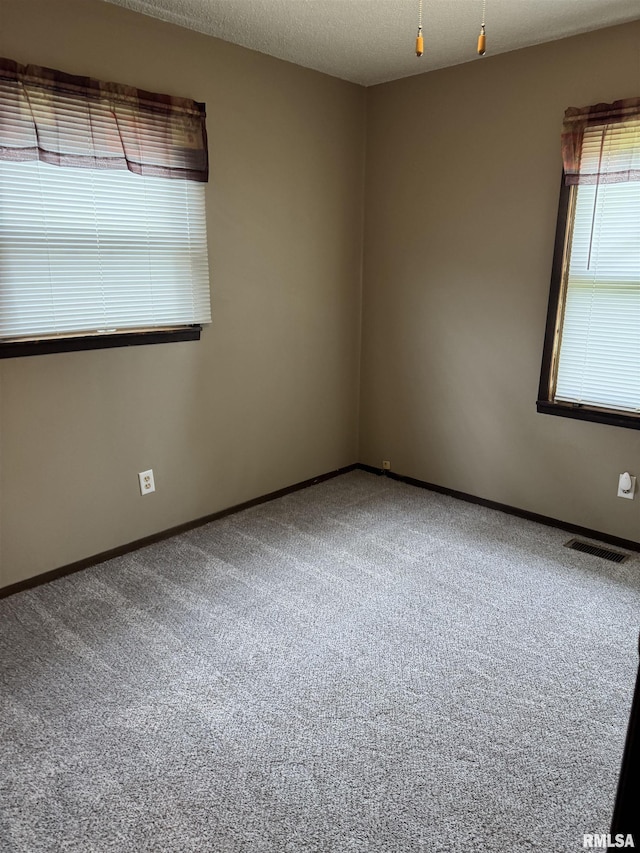 10333 Evergreen Dr, Manito, IL 61546 - carpeted empty room featuring baseboards
