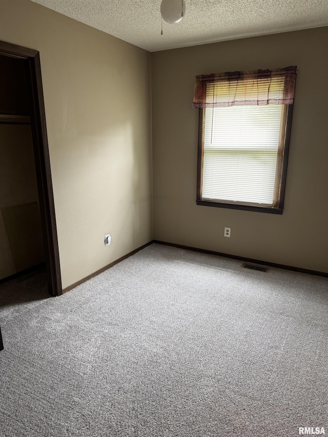 10333 Evergreen Dr, Manito, IL 61546 - unfurnished bedroom with carpet and a textured ceiling