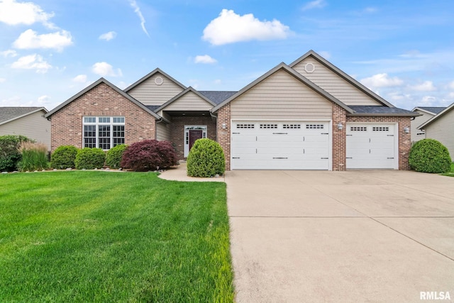 2308 Halifax Ave, Chatham, IL 62629 - view of front of home with an attached garage, driveway, brick siding, and a front lawn