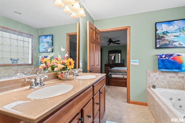 2308 Halifax Ave, Chatham, IL 62629 - full bath featuring connected bathroom, a whirlpool tub, double vanity, tile patterned floors, and ceiling fan